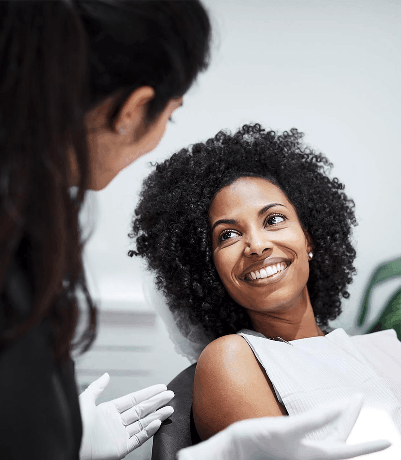 Woman Smiling post Dental Treatment | Indigo Dental Jersey